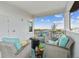 Inviting balcony with cozy seating, a fire pit, and scenic views of the marina at 3027 Bermuda Sloop Cir, Ruskin, FL 33570