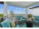 Spacious balcony with cozy seating, a fire pit, and panoramic views of the surrounding area at 3027 Bermuda Sloop Cir, Ruskin, FL 33570