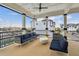 Inviting outdoor balcony with comfortable seating and views of the harbor at 3027 Bermuda Sloop Cir, Ruskin, FL 33570