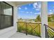 Scenic view from balcony overlooking a marina, lush green space, and clear blue sky at 3027 Bermuda Sloop Cir, Ruskin, FL 33570