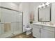 A modern bathroom featuring a spacious shower and elegant vanity at 3027 Bermuda Sloop Cir, Ruskin, FL 33570