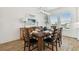 Elegant dining room featuring a wooden table, seating for six, and modern lighting at 3027 Bermuda Sloop Cir, Ruskin, FL 33570