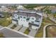 Modern townhome featuring a four-car garage, upscale finishes, and attractive landscaping, close to a waterfront at 3027 Bermuda Sloop Cir, Ruskin, FL 33570