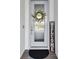 A welcoming front door with a decorative wreath and a charming 