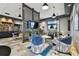 Comfortable lounge with a large screen TV, modern furniture, and stylish decor at 3027 Bermuda Sloop Cir, Ruskin, FL 33570
