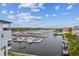 A beautiful view of the marina filled with boats docked in the tranquil blue water at 3027 Bermuda Sloop Cir, Ruskin, FL 33570