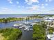 Overhead view of a marina with boats docked in the calm waters surrounded by lush greenery at 3027 Bermuda Sloop Cir, Ruskin, FL 33570