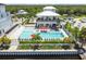 Beautiful pool area with lounge chairs, umbrellas, and lush landscaping with a beautiful waterfront backdrop at 3027 Bermuda Sloop Cir, Ruskin, FL 33570