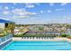 Luxury pool with ample lounge chairs, a clear view of the harbor, and lush tropical landscaping at 3027 Bermuda Sloop Cir, Ruskin, FL 33570