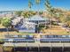 Aerial view of a waterfront restaurant featuring outdoor seating and a pier, a perfect spot for dining at 3027 Bermuda Sloop Cir, Ruskin, FL 33570