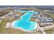 Aerial view of Crystal Lagoon amenity with surrounding homes at 31814 Oyster Trellis Ln, Wesley Chapel, FL 33545