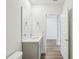 Modern bathroom with a double vanity and grey cabinets at 31814 Oyster Trellis Ln, Wesley Chapel, FL 33545