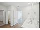 Main bathroom with double vanity and access to bedroom and toilet at 31814 Oyster Trellis Ln, Wesley Chapel, FL 33545