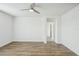 Spacious bedroom with wood-look flooring and a ceiling fan at 31814 Oyster Trellis Ln, Wesley Chapel, FL 33545