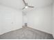 Well-lit bedroom with grey carpet and ceiling fan at 31814 Oyster Trellis Ln, Wesley Chapel, FL 33545