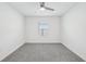 Spacious bedroom with grey carpet and a window at 31814 Oyster Trellis Ln, Wesley Chapel, FL 33545