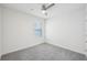 Bright bedroom featuring grey carpet and a ceiling fan at 31814 Oyster Trellis Ln, Wesley Chapel, FL 33545