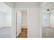 Bright hallway with doors to bedrooms and bathroom at 31814 Oyster Trellis Ln, Wesley Chapel, FL 33545