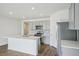 Modern kitchen with stainless steel appliances and an island at 31814 Oyster Trellis Ln, Wesley Chapel, FL 33545