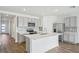 Modern kitchen with stainless steel appliances and an island at 31814 Oyster Trellis Ln, Wesley Chapel, FL 33545