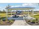 Community playground with shaded picnic tables at 31814 Oyster Trellis Ln, Wesley Chapel, FL 33545