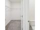 Large walk-in closet with wire shelving and carpet flooring at 31814 Oyster Trellis Ln, Wesley Chapel, FL 33545