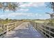 Wooden dock extending over calm lake water at 31814 Oyster Trellis Ln, Wesley Chapel, FL 33545