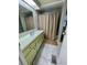 Bathroom with shower/tub combo, vanity, and linen closet at 34212 Canal N Dr # B, Pinellas Park, FL 33781