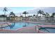 Community pool and spa with surrounding lounge chairs at 34212 Canal N Dr # B, Pinellas Park, FL 33781