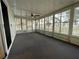 Bright sunroom with multiple windows and ceiling fan at 34212 Canal N Dr # B, Pinellas Park, FL 33781