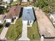 Aerial view showcasing two new homes, one with gray siding and the other with brown at 3515 55Th Ave N, St Petersburg, FL 33714
