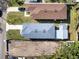 Aerial view of two new homes, one gray and one brown, on adjacent lots at 3515 55Th Ave N, St Petersburg, FL 33714