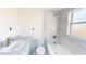 Clean bathroom with marble-tiled shower and bathtub at 3515 55Th Ave N, St Petersburg, FL 33714