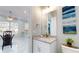 Guest bathroom with granite countertop and white cabinets at 3515 55Th Ave N, St Petersburg, FL 33714