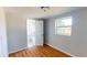 Cozy bedroom with wood-look floors and an ensuite bath at 3515 55Th Ave N, St Petersburg, FL 33714