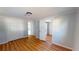 Simple bedroom with light walls, wood-look flooring and double door closet at 3515 55Th Ave N, St Petersburg, FL 33714