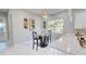 Small dining area with glass table and two barstools at 3515 55Th Ave N, St Petersburg, FL 33714
