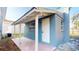 Charming blue house with a covered porch and patio at 3515 55Th Ave N, St Petersburg, FL 33714