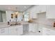 Modern kitchen with white cabinets, granite countertops and double sink at 3515 55Th Ave N, St Petersburg, FL 33714