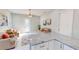 Modern kitchen with white cabinets, granite countertops and island at 3515 55Th Ave N, St Petersburg, FL 33714