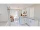 Modern kitchen with white cabinets, granite countertops and island at 3515 55Th Ave N, St Petersburg, FL 33714