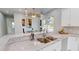 Modern kitchen with white cabinets, granite countertops and double sink at 3515 55Th Ave N, St Petersburg, FL 33714