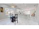 Bright kitchen with white cabinets, granite counters, and breakfast bar at 3515 55Th Ave N, St Petersburg, FL 33714