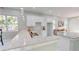 Modern kitchen with white cabinets, granite countertops and double sink at 3515 55Th Ave N, St Petersburg, FL 33714