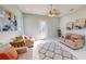 Bright living room with comfy sofas, a large rug, and natural light at 3515 55Th Ave N, St Petersburg, FL 33714