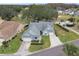 Aerial view of two-story home with attached garage and nicely landscaped yard at 3624 Muirfield Ct, New Port Richey, FL 34655