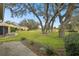 Spacious backyard with golf course view and mature trees at 3624 Muirfield Ct, New Port Richey, FL 34655