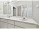 Bathroom with double sinks and a large mirror at 3624 Muirfield Ct, New Port Richey, FL 34655