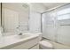 Bright bathroom with a shower/tub combo, toilet and vanity with sink at 3624 Muirfield Ct, New Port Richey, FL 34655