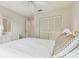 Main bedroom with large closet, and ceiling fan at 3624 Muirfield Ct, New Port Richey, FL 34655